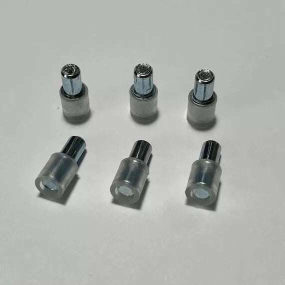 Pack of 12 transparent plastic support pins 101577. Replacement part for glass shelves in IKEA cabinets like DETOLF, BESTÅ, and more.